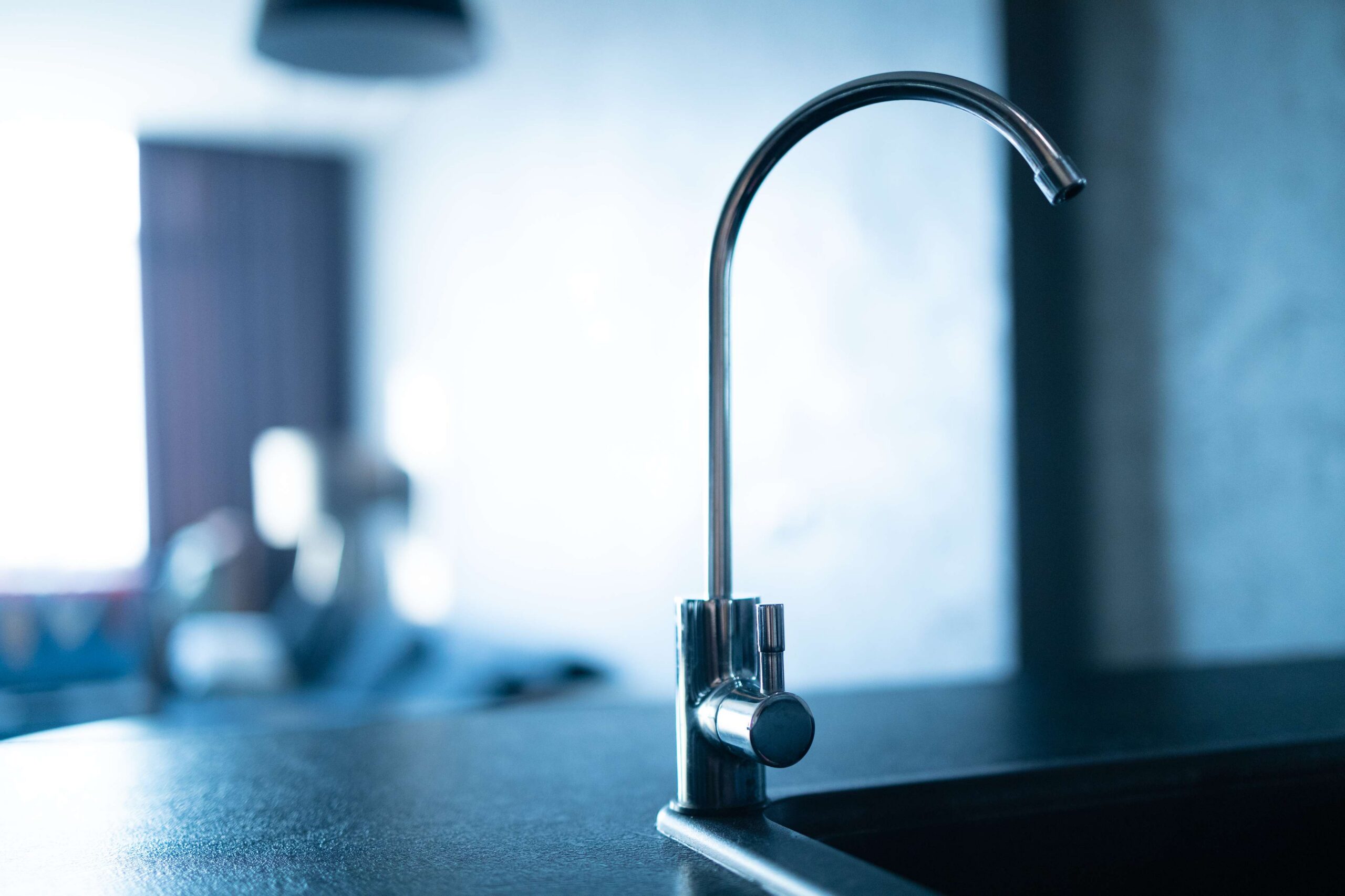 chrome-kitchen-faucet-against-out-of-focus-backgro-2026-09-24-09-54-53-utc