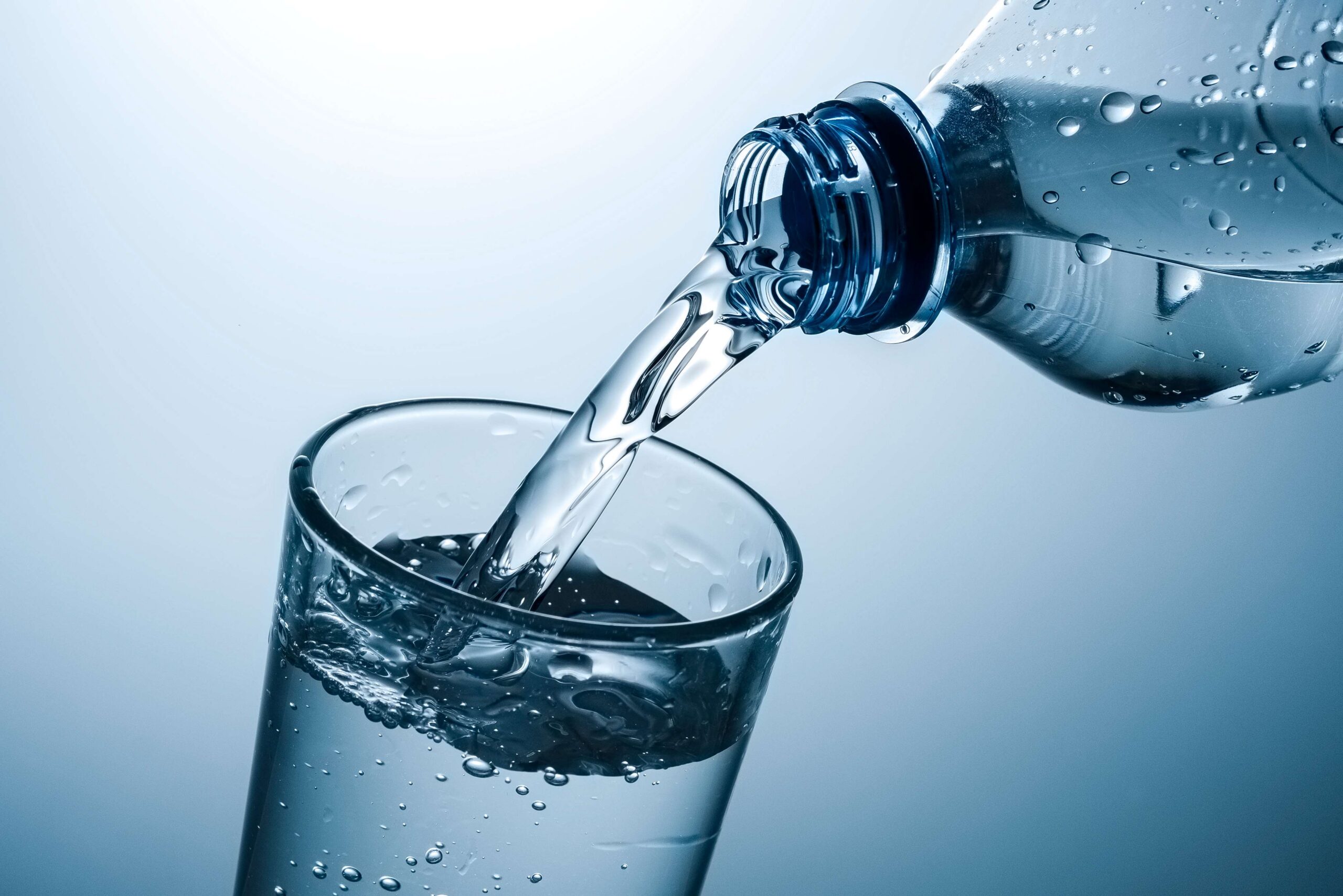 water-pouring-into-glass-on-a-light-background-2026-09-23-05-26-54-utc