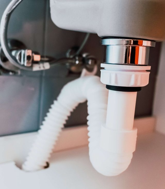 close-up-of-plumbing-under-sink-in-bathroom-2026-09-22-17-31-48-utc